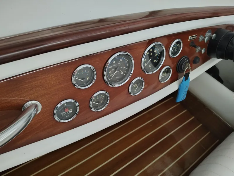 Slide: The Image of 1989 Kavalk Continental dashboard with wooden panel and multiple gauges. - 14