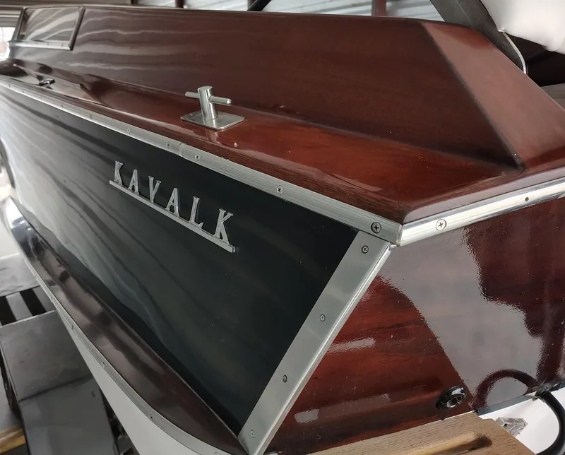 Slide: The Image of 1989 Kavalk Continental boat with polished wood finish and metal trim. - 22