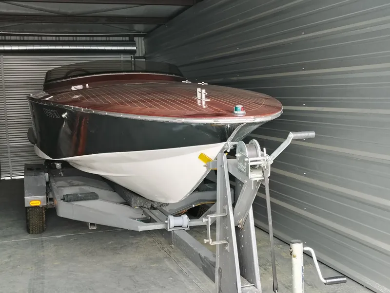 Slide: The Image of 1989 Kavalk Continental boat on trailer in storage unit. - 24