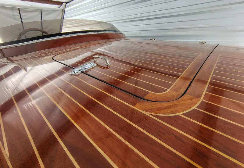 Slide: The Image of 1989 Kavalk Continental boat with polished wooden deck and sleek design. - 4