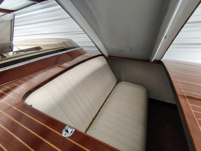 Slide: The Image of 1989 Kavalk Continental boat interior with white cushioned seating and wooden trim. - 8
