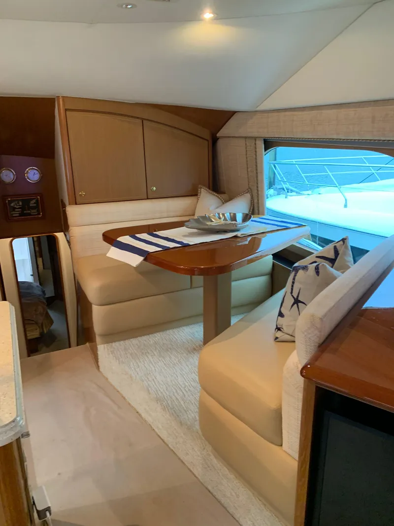 Slide: The Image of Luxurious interior of 2004 Ocean Yachts 57 Odyssey with elegant dining area. - 18