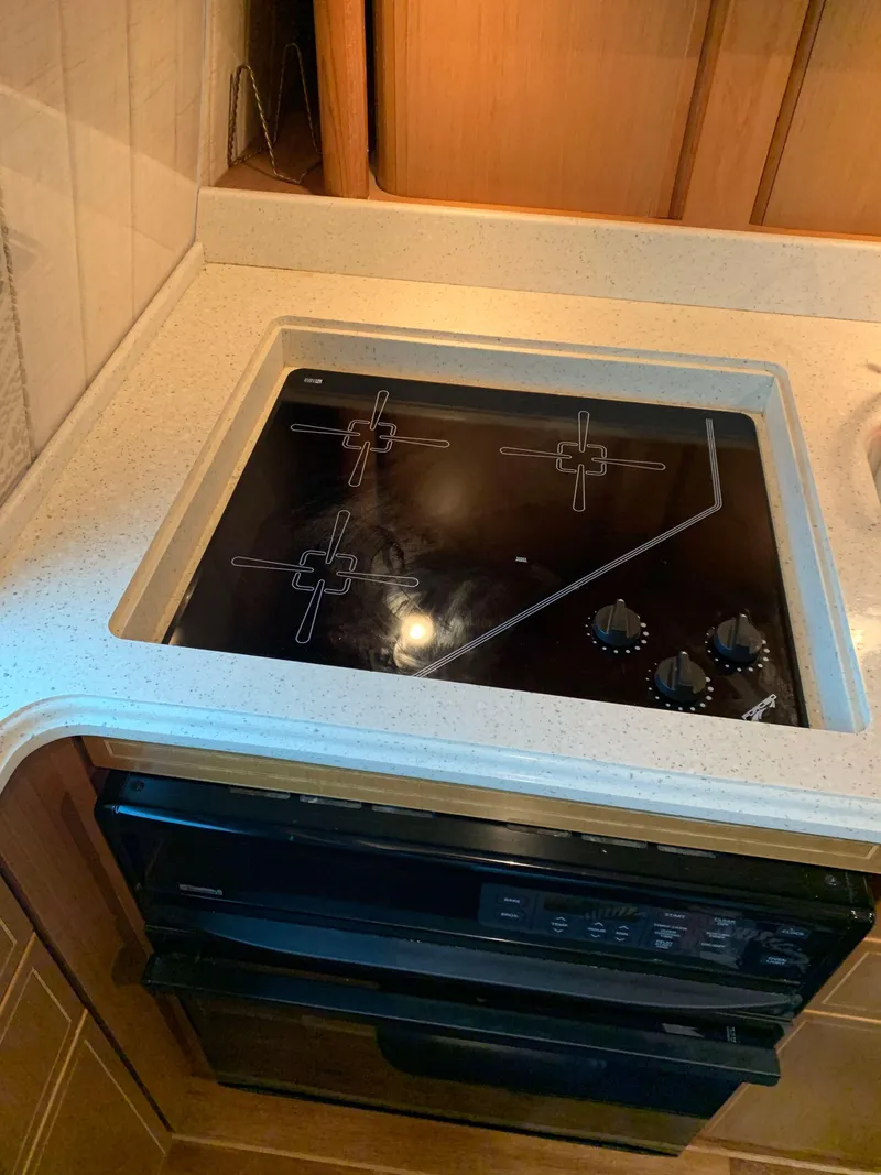 Slide: The Image of Stovetop in 2004 Ocean Yachts 57 Odyssey kitchen area. - 22