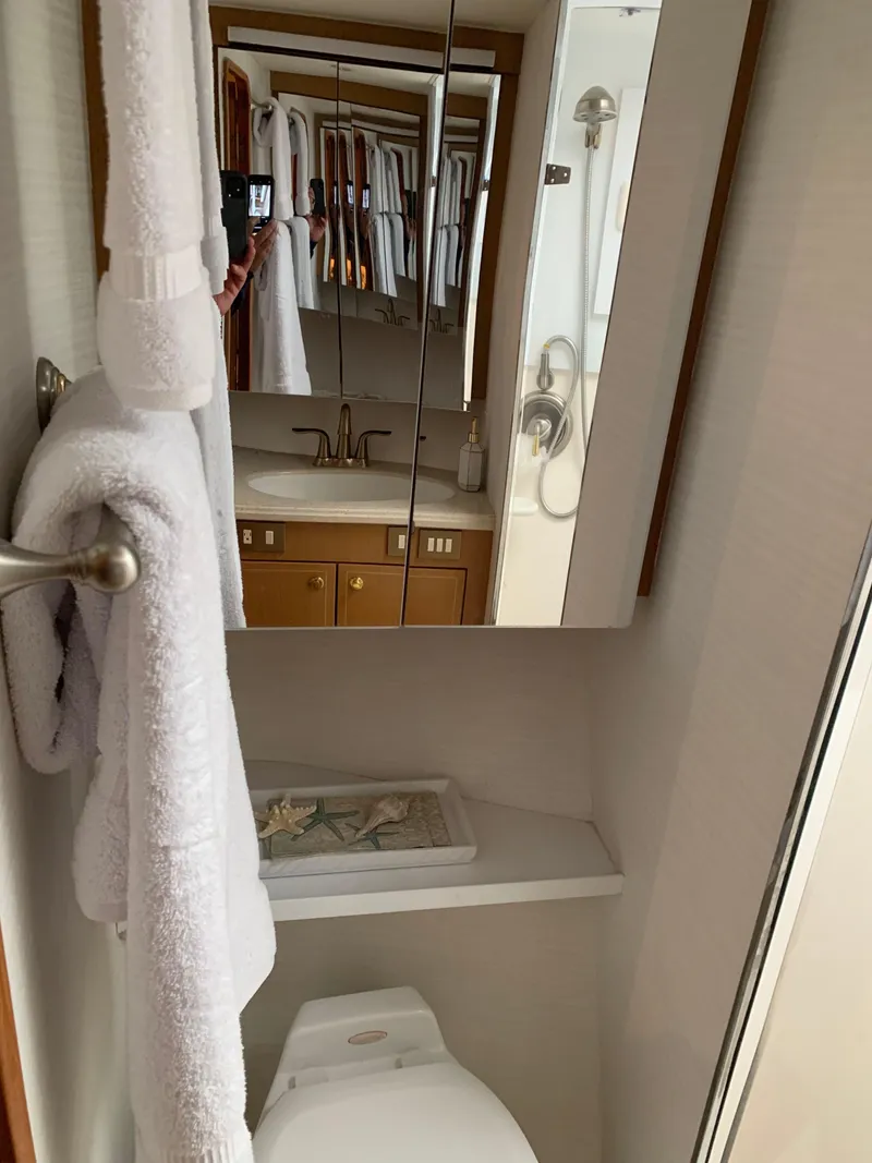Slide: The Image of Bathroom interior of 2004 Ocean Yachts 57 Odyssey with towels and mirror. - 30
