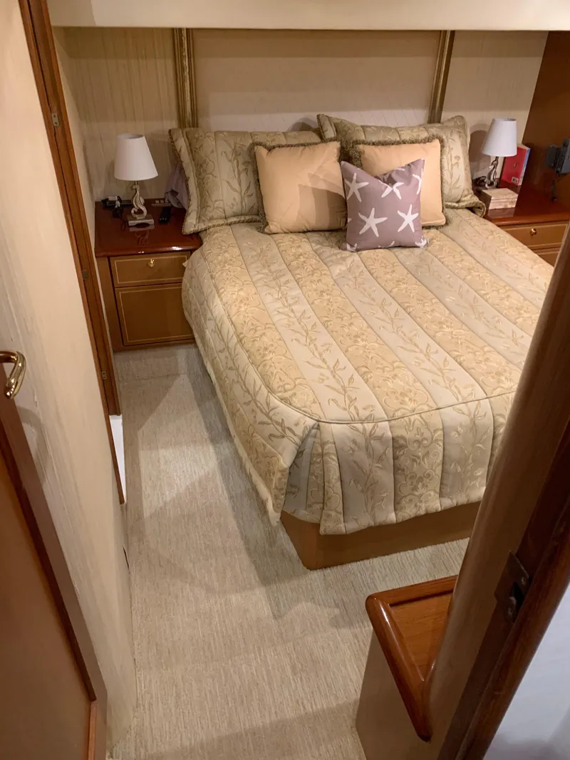 Slide: The Image of Luxurious bedroom in 2004 Ocean Yachts 57 Odyssey with elegant bedding and decor. - 34