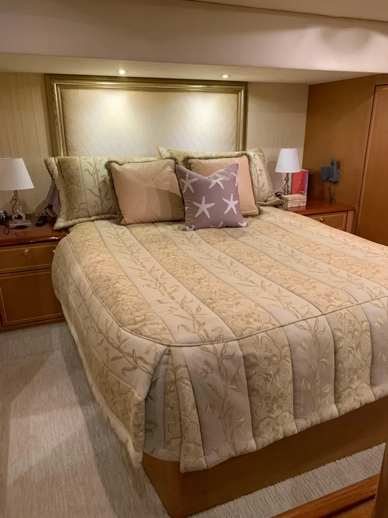 Slide: The Image of Luxurious bedroom in 2004 Ocean Yachts 57 Odyssey with elegant bedding and ambient lighting. - 37