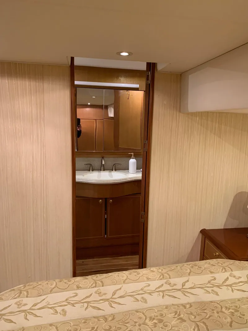 Slide: The Image of Luxurious interior of 2004 Ocean Yachts 57 Odyssey, featuring elegant wood finishes and modern amenities. - 38