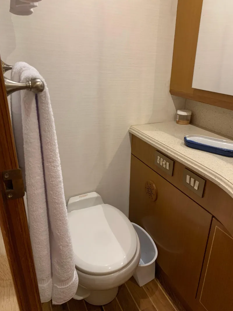 Slide: The Image of Bathroom interior of 2004 Ocean Yachts 57 Odyssey, featuring toilet and vanity. - 42