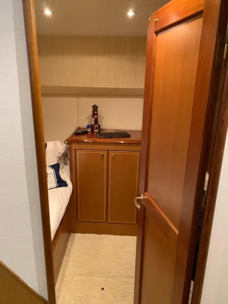 Slide: The Image of Cozy cabin interior of 2004 Ocean Yachts 57 Odyssey with wooden furnishings. - 46