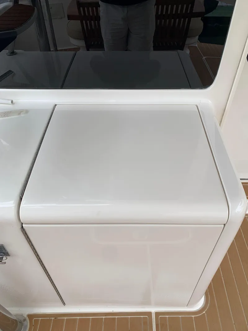 Slide: The Image of 2004 Ocean Yachts 57 Odyssey yacht deck detail with white storage compartment. - 9