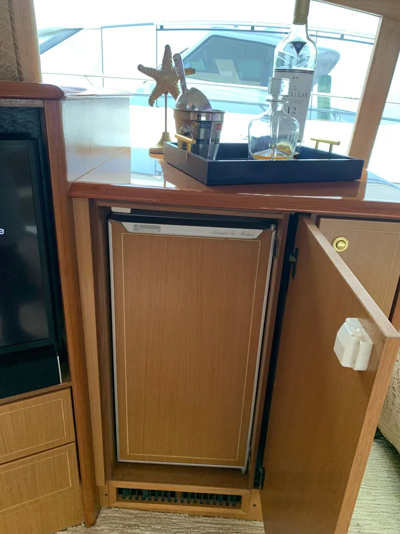 Slide: The Image of Luxury interior of 2004 Ocean Yachts 57 Odyssey with minibar and decor. - 16