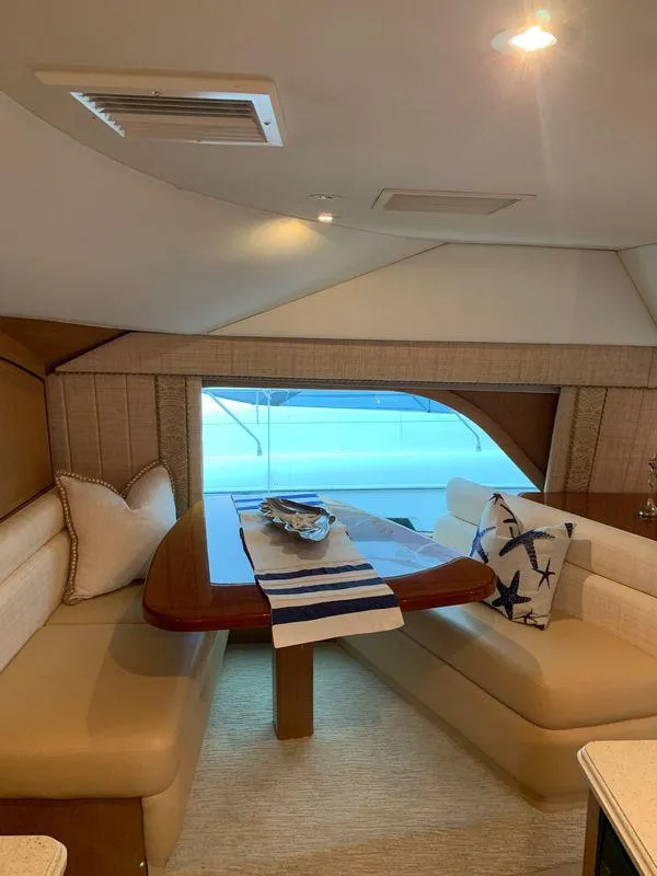 Slide: The Image of Luxurious interior of 2004 Ocean Yachts 57 Odyssey with elegant seating and nautical decor. - 19