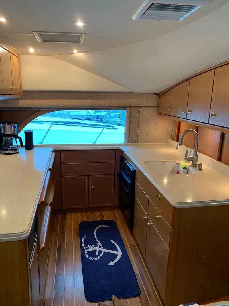 Slide: The Image of Luxurious kitchen interior of 2004 Ocean Yachts 57 Odyssey with wood cabinetry and modern appliances. - 20