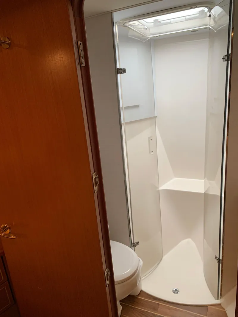 Slide: The Image of 2004 Ocean Yachts 57 Odyssey bathroom with shower and toilet. - 29