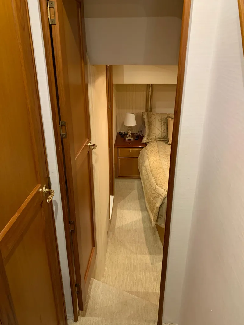 Slide: The Image of Cozy bedroom interior of 2004 Ocean Yachts 57 Odyssey with wooden accents. - 33