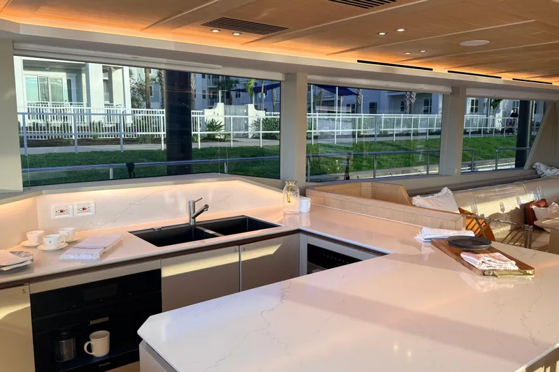 Slide: The Image of Luxurious Granocean W72 yacht kitchen interior, featuring sleek countertops and modern design, 2025 model. - 17