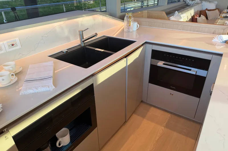 Slide: The Image of Modern kitchen on Granocean W72 yacht, featuring sleek countertops, sink, and built-in appliances, 2025 model. - 19