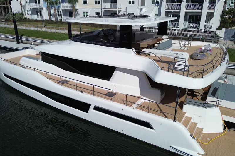 Slide: The Image of Luxurious 2025 Granocean W72 yacht docked, showcasing sleek design and spacious decks. - 2