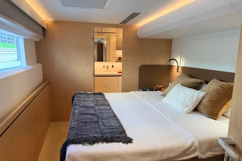 Slide: The Image of Luxurious Granocean W72 yacht bedroom interior, featuring modern design and cozy bedding, 2025 model. - 24