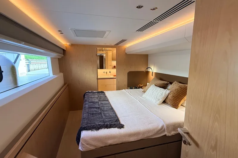 Slide: The Image of Luxurious Granocean W72 yacht bedroom, 2025 model, featuring modern design and cozy bedding. - 25