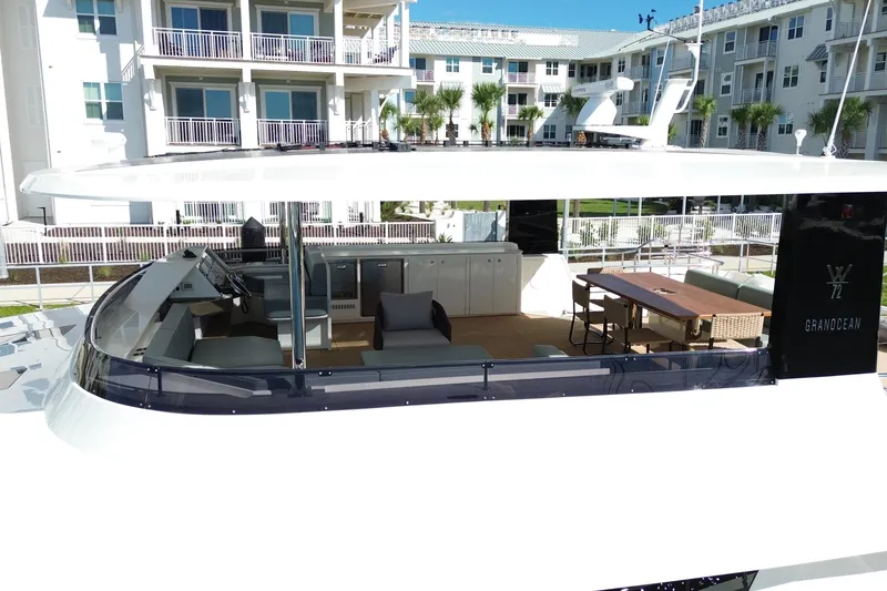 Slide: The Image of Luxurious Granocean W72 yacht interior, featuring modern seating and dining area, 2025 model. - 28