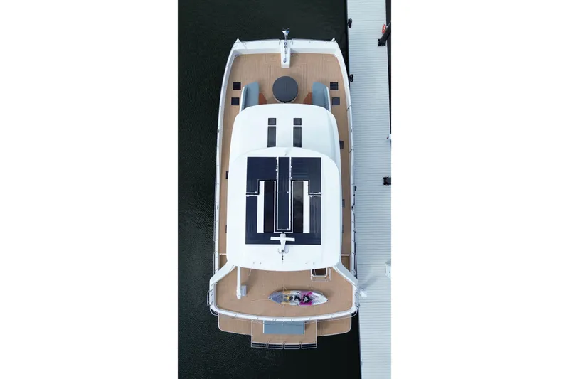 Slide: The Image of Overhead view of 2025 Granocean W72 yacht docked, showcasing sleek design and spacious deck. - 5