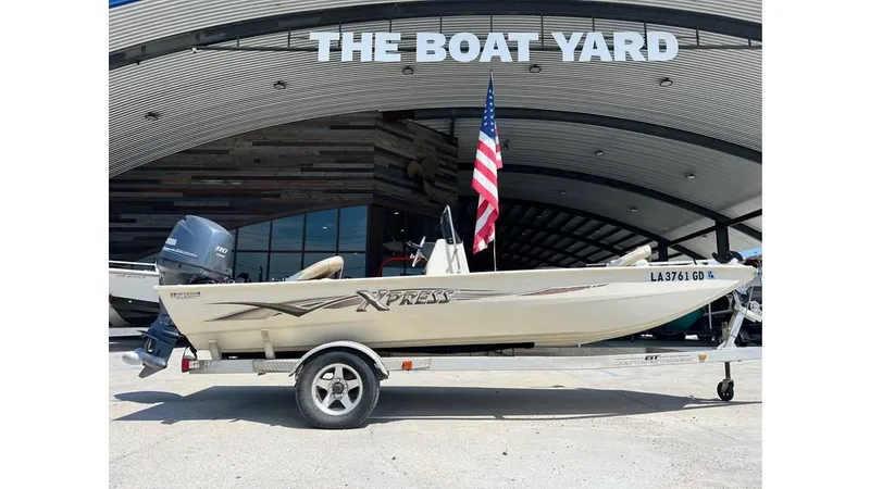 Slide: The Image of 2014 Express XP 18 CC boat on trailer at The Boat Yard. - 1
