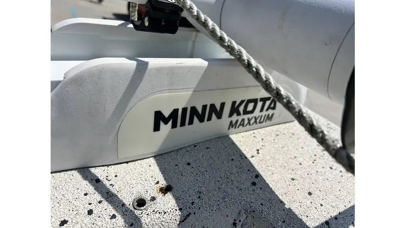 Slide: The Image of Minn Kota Maxxum motor on 2014 Express XP 18 CC boat deck. - 10