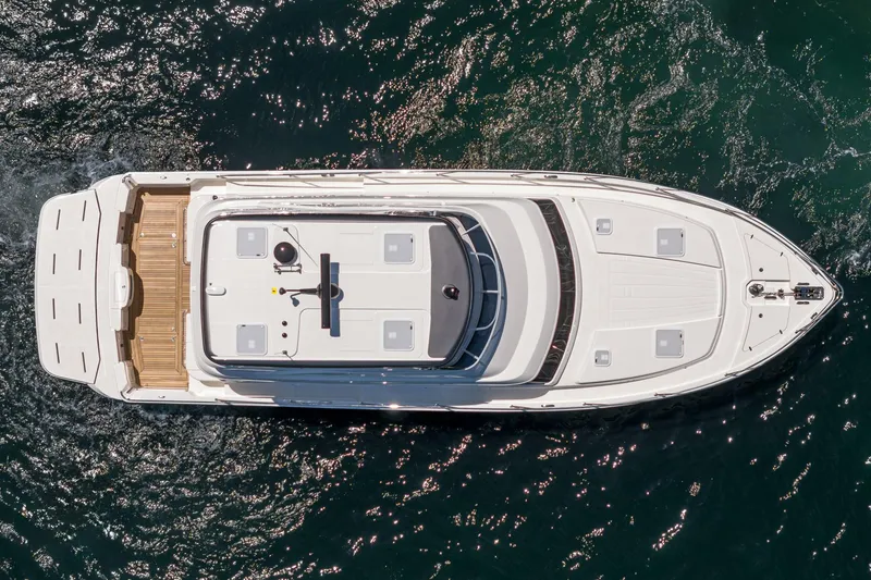 Slide: The Image of Overhead view of 2025 Riviera 46 Sport Motor Yacht on water. - 13