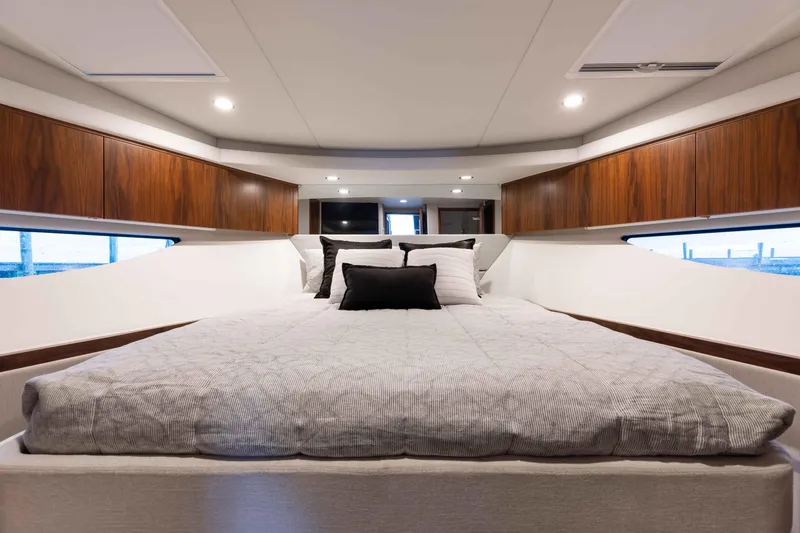 Slide: The Image of Interior of 2025 Riviera 46 Sport Motor Yacht bedroom with modern design. - 15