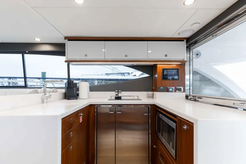 Slide: The Image of Modern kitchen interior of 2025 Riviera 46 Sport Motor Yacht with sleek appliances. - 31