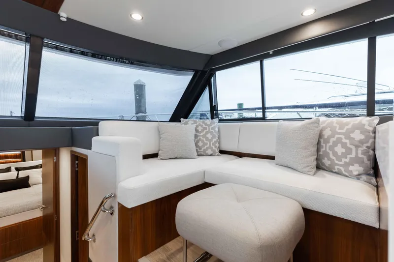 Slide: The Image of Interior of 2025 Riviera 46 Sport Motor Yacht with plush seating and modern design. - 33