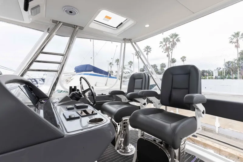 Slide: The Image of Interior of 2025 Riviera 46 Sport Motor Yacht with modern helm and seating. - 41