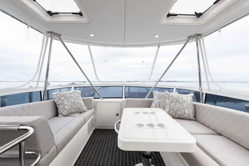 Slide: The Image of Luxurious interior of 2025 Riviera 46 Sport Motor Yacht with elegant seating and ocean view. - 42