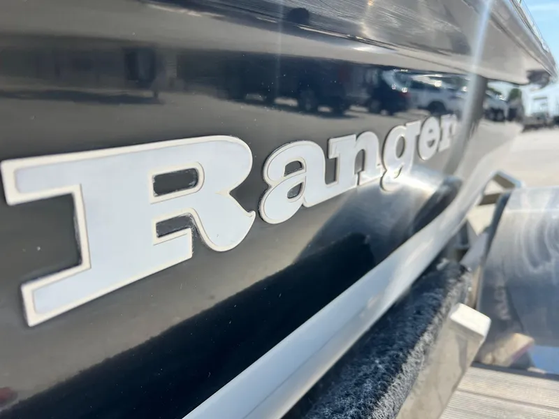 Slide: The Image of Close-up of 2009 Ranger 184 Ghost boat logo on a sleek, dark hull. - 3