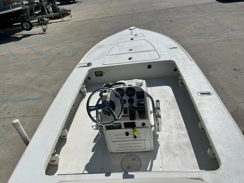 Slide: The Image of 2009 Ranger 184 Ghost boat interior with steering console and storage compartments. - 5