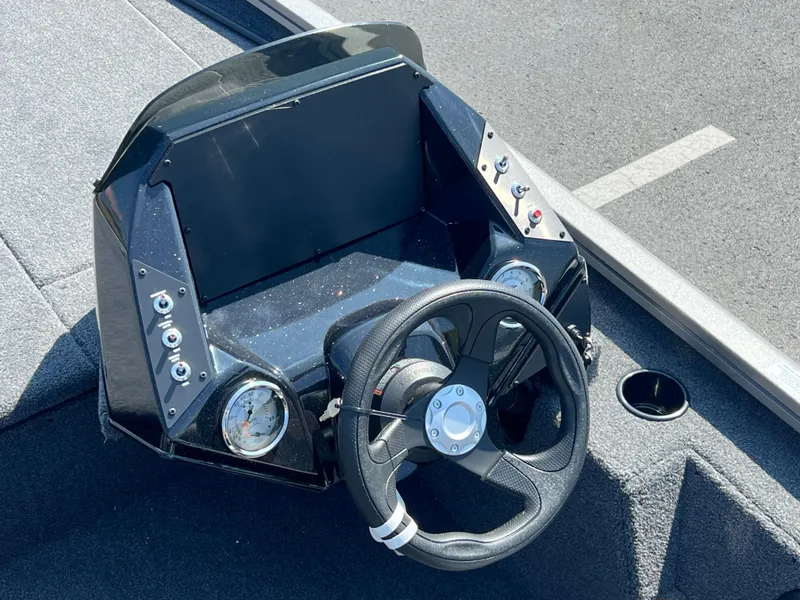 Slide: The Image of 2024 Crestliner XF 189 boat dashboard with steering wheel and gauges. - 10