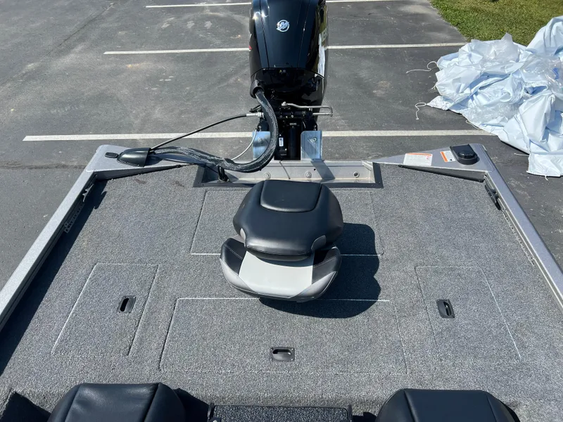Slide: The Image of 2024 Crestliner XF 189 boat deck with motor and seating. - 11
