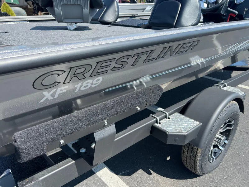 Slide: The Image of 2024 Crestliner XF 189 boat on trailer, showcasing sleek design and branding. - 2