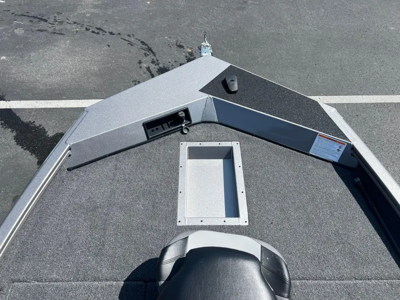 Slide: The Image of 2024 Crestliner XF 189 boat deck with storage compartment and seating. - 4