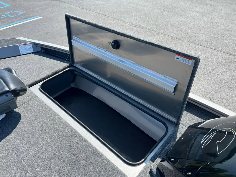 Slide: The Image of 2024 Crestliner XF 189 boat storage compartment open on deck. - 7
