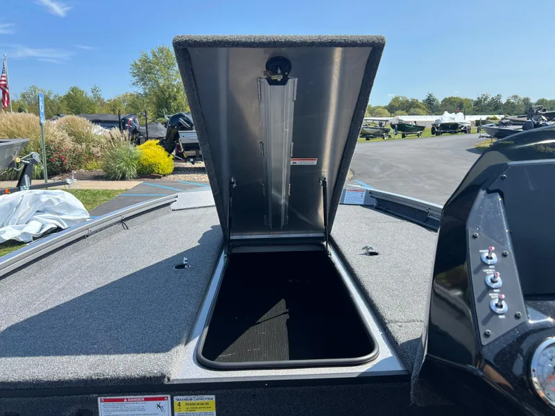Slide: The Image of 2024 Crestliner XF 189 boat with open storage compartment on deck. - 8