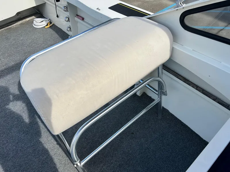 Slide: The Image of 1993 Gravois 23 DC boat interior with cushioned seat and metal frame. - 5
