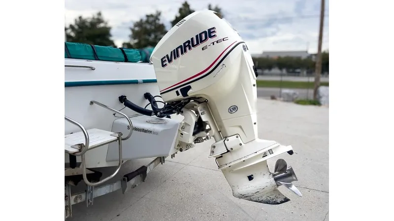 Slide: The Image of 1998 Sunbird 230 CC boat console with steering wheel, gauges, and Garmin navigation system. - 5