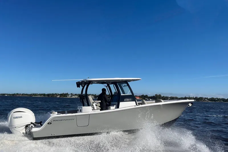 The Image of 2025 Sportsman Open 282 Center Console boat cruising on open water. - 0