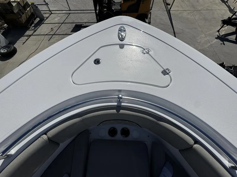 Slide: The Image of Bow of 2025 Sportsman Open 282 boat with sleek design and storage hatch. - 15