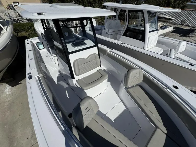 Slide: The Image of 2025 Sportsman Open 282 boat with sleek design and spacious seating. - 19