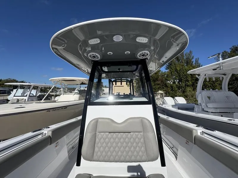 Slide: The Image of 2025 Sportsman Open 282 boat interior with modern seating and console design. - 21