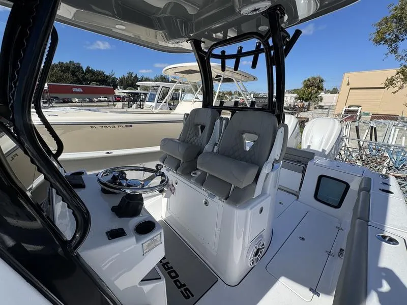 Slide: The Image of 2025 Sportsman Open 282 boat interior with dual seats and steering console. - 26