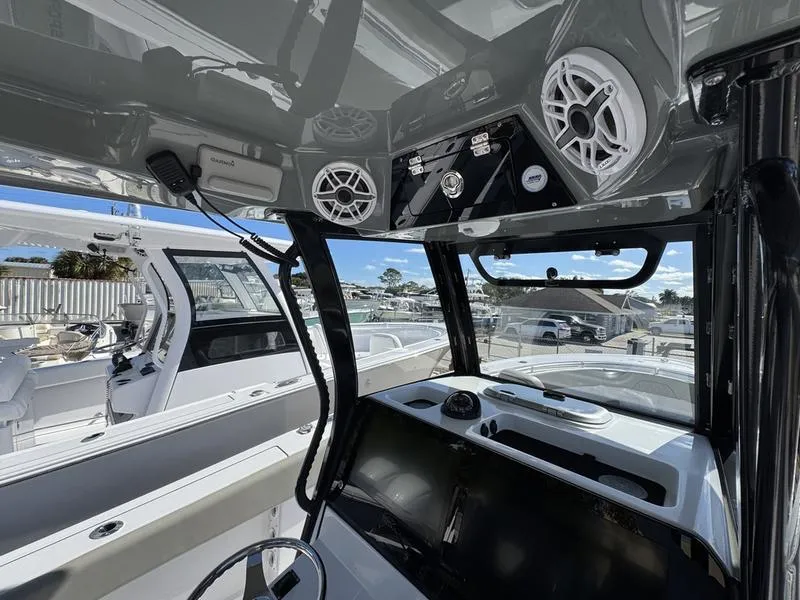 Slide: The Image of 2025 Sportsman Open 282 boat interior with modern controls and speakers. - 32